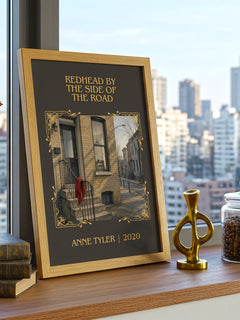 Redhead By The Side Of The Road Classic Book Art Print by Anne Tyler – framed print on a city-view windowsill