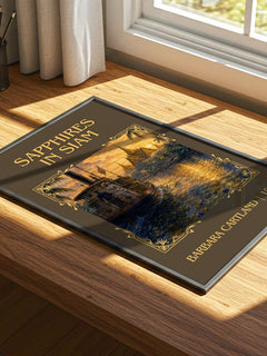 Sapphires In Siam Classic Book Art Print by Barbara Cartland – print on a sunlit desk