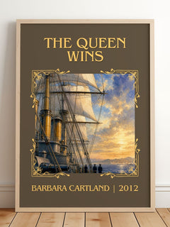 The Queen Wins Classic Book Art Print by Barbara Cartland – framed print leaning on a wooden floor