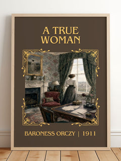 A True Woman Classic Book Art Print by Baroness Orczy – framed print leaning on a wooden floor