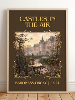 Castles In The Air Classic Book Art Print by Baroness Orczy – framed print leaning on a wooden floor