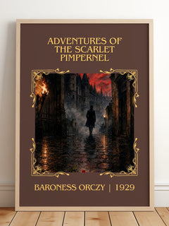 Adventures Of The Scarlet Pimpernel Classic Book Art Print by B. Orczy – framed print leaning on a wooden floor