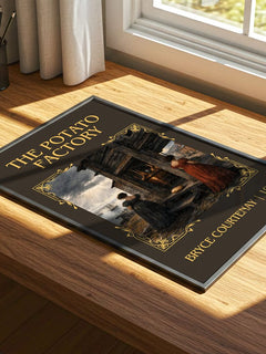 The Potato Factory Classic Book Art Print by Bryce Courtenay – print on a sunlit desk