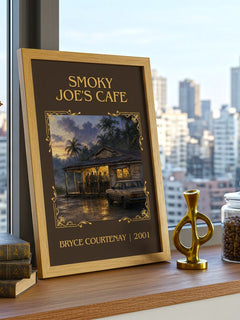 Smoky Joe'S Cafe Classic Book Art Print by Bryce Courtenay – framed print on a city-view windowsill