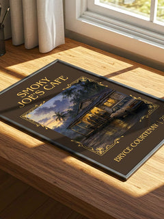 Smoky Joe'S Cafe Classic Book Art Print by Bryce Courtenay – print on a sunlit desk