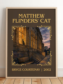 Matthew Flinders' Cat Classic Book Art Print by Bryce Courtenay – framed print leaning on a wooden floor