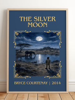 The Silver Moon Classic Book Art Print by Bryce Courtenay – framed print leaning on a wooden floor