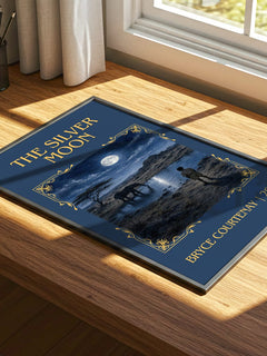 The Silver Moon Classic Book Art Print by Bryce Courtenay – print on a sunlit desk