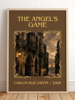 The Angel'S Game Classic Book Art Print by Carlos Ruiz Zafón – framed print leaning on a wooden floor