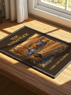 The Stranger Classic Book Art Print by Chris Van Allsburg – print on a sunlit desk