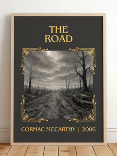 The Road Classic Book Art Print by Cormac Mccarthy – framed print leaning on a wooden floor
