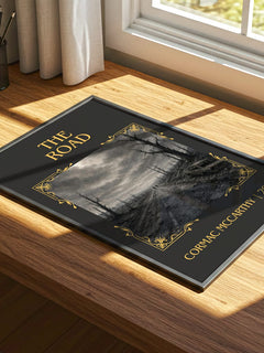 The Road Classic Book Art Print by Cormac Mccarthy – print on a sunlit desk