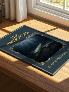 The Passenger Classic Book Art Print by Cormac Mccarthy – print on a sunlit desk