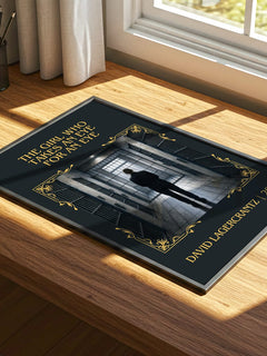The Girl Who Takes An Eye For An Eye Classic Book Art Print by David Lagercrantz – print on a sunlit desk
