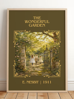 The Wonderful Garden Classic Book Art Print by E. Nesbit – framed print leaning on a wooden floor