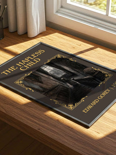 The Hapless Child Classic Book Art Print by Edward Gorey – print on a sunlit desk