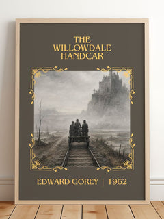 The Willowdale Handcar Classic Book Art Print by Edward Gorey – framed print leaning on a wooden floor