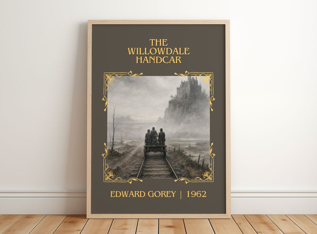 The Willowdale Handcar Classic Book Art Print by Edward Gorey – framed print leaning on a wooden floor