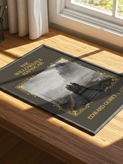The Willowdale Handcar Classic Book Art Print by Edward Gorey – print on a sunlit desk