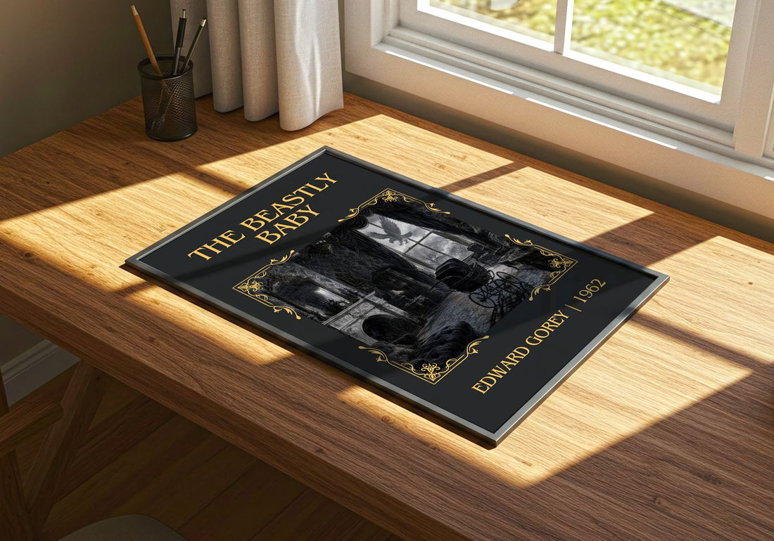 The Beastly Baby Classic Book Art Print by Edward Gorey – print on a sunlit desk