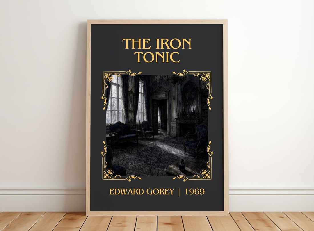 The Iron Tonic Classic Book Art Print by Edward Gorey – framed print leaning on a wooden floor