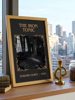The Iron Tonic Classic Book Art Print by Edward Gorey – framed print on a city-view windowsill