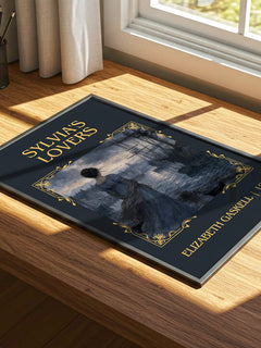 Sylvia'S Lovers Classic Book Art Print by Elizabeth Gaskell – print on a sunlit desk