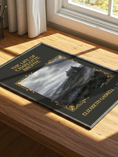 Life Of Charlotte Brontë Classic Book Art Print by Elizabeth Gaskell – print on a sunlit desk
