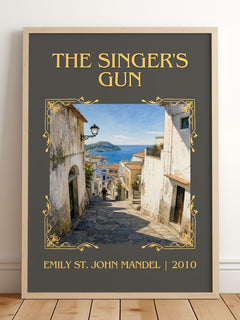 The Singer'S Gun Classic Book Art Print by Emily St. John Mandel – framed print leaning on a wooden floor