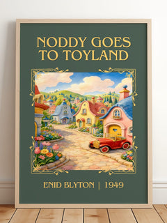 Noddy Goes To Toyland Classic Book Art Print by Enid Blyton – framed print leaning on a wooden floor