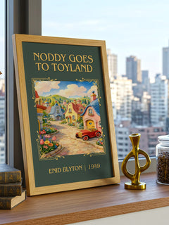 Noddy Goes To Toyland Classic Book Art Print by Enid Blyton – framed print on a city-view windowsill