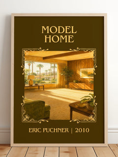 Model Home Classic Book Art Print by Eric Puchner – framed print leaning on a wooden floor