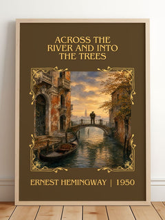 Across The River And Into The Trees Classic Book Art Print – framed print leaning on a wooden floor