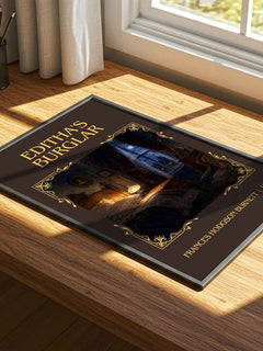 Editha'S Burglar Classic Book Art Print by Frances Hodgson Burnett – print on a sunlit desk