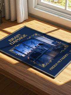 Brain Damage Classic Book Art Print by Freida Mcfadden – print on a sunlit desk