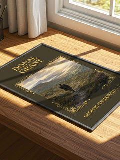 Donal Grant Classic Book Art Print by George Macdonald – print on a sunlit desk