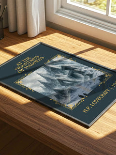 At The Mountains Of Madness Classic Book Art Print by H.P. Lovecraft – print on a sunlit desk
