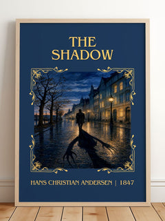 The Shadow Classic Book Art Print by Hans Christian Andersen – framed print leaning on a wooden floor
