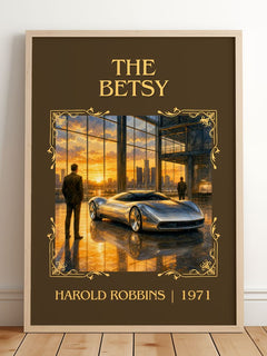 The Betsy Classic Book Art Print by Harold Robbins – framed print leaning on a wooden floor