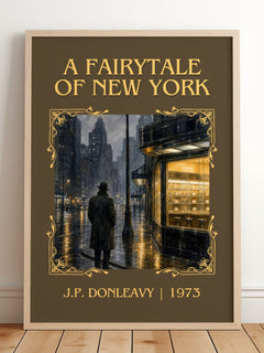 A Fairytale Of New York Classic Book Art Print by J.P. Donleavy – framed print leaning on a wooden floor