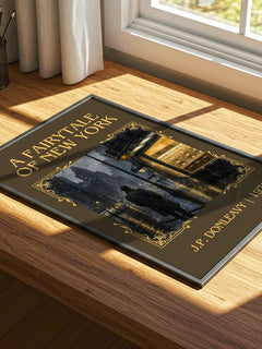 A Fairytale Of New York Classic Book Art Print by J.P. Donleavy – print on a sunlit desk