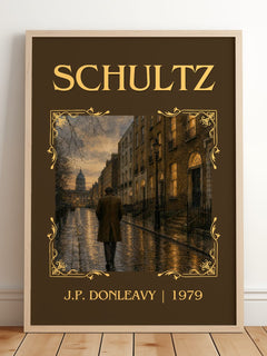 Schultz Classic Book Art Print by J.P. Donleavy – framed print leaning on a wooden floor