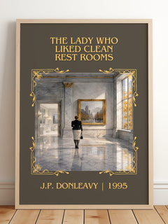 Lady Who Liked Clean Rest Rooms Classic Book Art Print by J. Donleavy – framed print leaning on a wooden floor