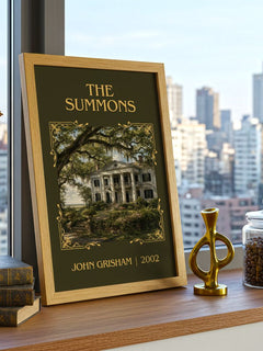 The Summons Classic Book Art Print by John Grisham – framed print on a city-view windowsill