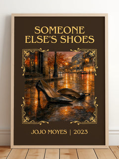 Someone Else's Shoes Classic Book Art Print by Jojo Moyes – framed print leaning on a wooden floor