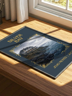 Silver Bay Classic Book Art Print by Jojo Moyes – print on a sunlit desk