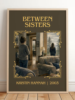 Between Sisters Classic Book Art Print by Kristin Hannah – framed print leaning on a wooden floor