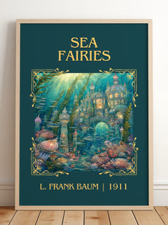 Sea Fairies Classic Book Art Print by L. Frank Baum – framed print leaning on a wooden floor