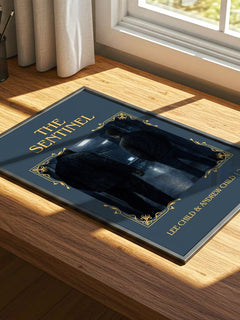 The Sentinel Classic Book Art Print by Lee Child & Andrew Child – print on a sunlit desk