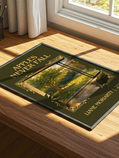 Apples Never Fall Classic Book Art Print by Liane Moriarty – print on a sunlit desk